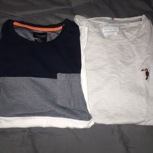 Two men’s T-shirts, $12 each, $20 for both.